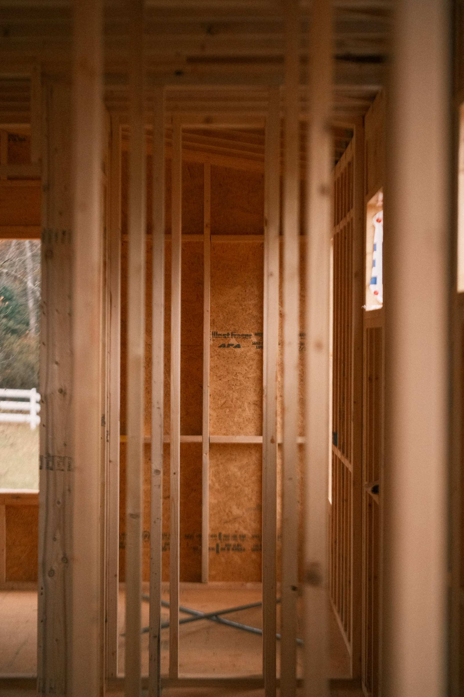 Residential building interior under construction with wooden framing